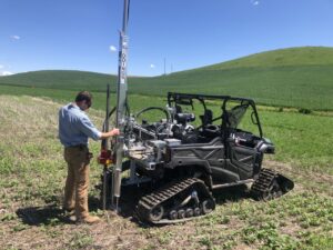 scientist conducting field soil sampling