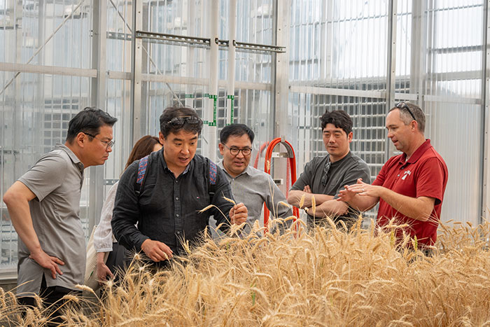 Arron Carter providing a tour of the plant breeding greenhouse