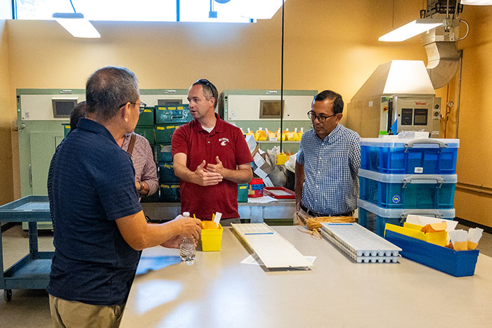 Arron Carter in lab with trade team