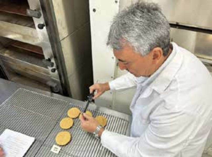 William Morales Colombina's operations manager, studies baked goods during the Soft Wheat Workshop at the Wheat Marketing Center.