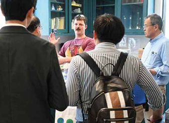 Daniel “Danny” Zborowski, biological science technician for the cultivar development team, explains the flour testing and analysis he performs at the Western Wheat Quality Lab to the 2025 Japanese Midlevel Management Trade Team.