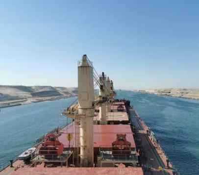 A cargo ship transiting through the Suez Canal.